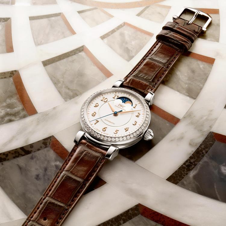 The white dial fake watch features a brown strap.